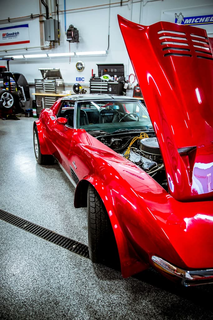 Car in the workshop with the bonnet open