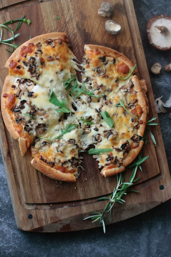 Mushroom pizza on a board